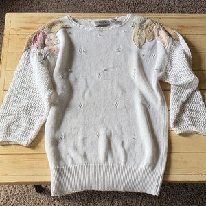 Stylish White Sweater with Colorful Shoulder Details